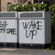 Graffiti on telecom equipment in Batley, the UK, promoting conspiracy theories about 5G connectivity technology in July 2021.
